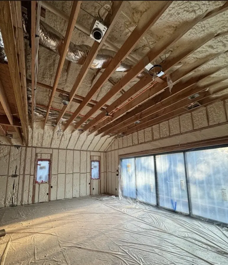 Interior walls and ceiling insulated with spray foam during new construction in Mechanicville